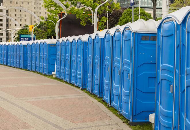 a line of portable restrooms at a sporting event, providing athletes and spectators with clean and accessible facilities in Catoosa